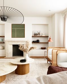 a living room filled with furniture and a fire place