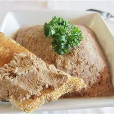 a white plate topped with meat and broccoli