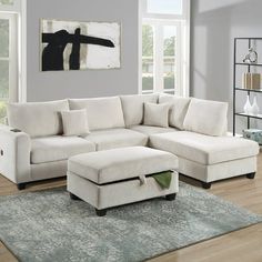 a living room with a sectional couch and ottoman