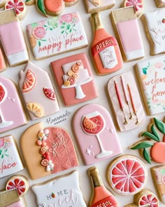 decorated cookies are arranged on a white surface