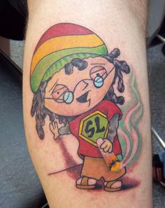 a person with a cartoon tattoo on their leg