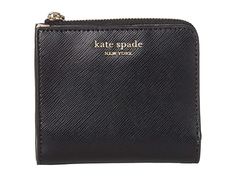 Kate Spade New York Spencer Small Bifold Wallet (Black) Wallet Add a touch of flair to your bag with the pebbled leather Kate Spade New York Spencer Small Bifold Wallet with back zip pocket and external slip pocket. Currency pocket features Floral Spade lining. Two hideaway pockets. Four card slots. Imported. Measurements: Middle Width: 4 1 2 in Top Width: 4 1 2 in Depth: 4 1 2 in Extended Depth: 1 2 in Height: 3 3 4 in Weig #KateSpadeNewYork #BagsandLuggage #SmallGoods #GeneralSmallGoods #Black Black Wallet, Bifold Wallet, Michael Kors Jet Set, Kate Spade New York, You Bag, Pebbled Leather, Slots, Zip Pockets, Kate Spade