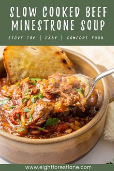 slow cooked beef minestone soup in a bowl with bread on the side