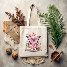 a tote bag sitting on top of a table next to some plants and nuts