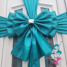 a blue bow on the front door of a house