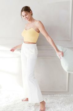 This NIKIBIKI Yellow Skinny Strap Cami Top is a versatile blend of a bra and cami, making it the perfect addition to any ensemble! The ultra-comfy yellow knit molds to your body and features a round neckline, slim white cami straps, a snug sleeveless design, and a cropped hem. It's ideal for Pilates or your next yoga sesh! DETAILS & FIT Fitted. Nylon/Spandex. Machine Wash Cold. Made in the USA. One size fits XS-XL ORDERS, SHIPPING & RETURNS Orders, Shipping, & Returns Yellow Crop Top With Built-in Bra, Yellow Crop Top With Built-in Bra For Spring, Casual Spaghetti Straps Crop Top For Yoga, Yellow Stretch Seamless Tank Top, Yellow Stretch Camisole With Spaghetti Straps, Stretch Seamless Yellow Tank Top, Stretch Yellow Seamless Tank Top, Yellow Seamless Stretch Tank Top, Fitted Yellow Seamless Crop Top