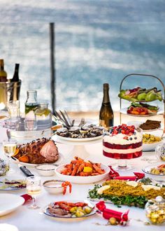 a table topped with lots of different types of foods and desserts next to each other