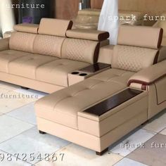 an image of a couch that is in the middle of tile flooring and it has two recliners facing each other