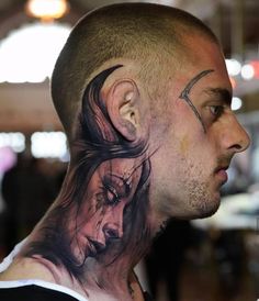 a man with a tattoo on his neck