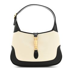 This is an authentic GUCCI Boarded Dyana Lux Calfskin Bi-Color Small Jackie 1961 Hobo in Mystic White and Black. This stylish hobo is crafted of luxuriously smooth leather in black and white.  The bag features a leather shoulder strap and a cross-over piston closure.  This opens to a natural fabric interior with zipper and patch pockets. Jackie 1961 Gucci Outfit, Gucci Jackie 1961, Gucci Outfit, Gucci Crossbody Bag, Gucci Crossbody, Gucci Monogram, Gucci Shoulder Bag, Natural Fabric, Bag Light