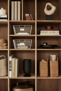 bookshelves with baskets and other items on them