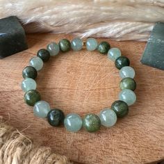 This natural stone bracelet is composed of an 8 mm bead of green aventurine and jade ✨🍀 Virtues and benefits of green aventurine On a mental/spiritual level - Brings luck and good fortune. - Calms the mind. - Calms nervousness, stress and fears. - Aids in mental calm and inner peace. - Promotes decision making. - Helps to be yourself. - Help for the creation and brings determination in the projects. - Restores humor and cheerfulness. - Brings patience, tolerance On a physical level - Acts on st Green Amazonite Bracelet With Natural Stones, Green Jade Crystal Bracelet For Meditation, Green Bracelets With Natural Stones, Green Aventurine Crystal Bracelet With Natural Stones, Green Jade Crystal Bracelet Spiritual Style, Green Jade Crystal Bracelet For Spiritual Healing, Green Amazonite Beaded Bracelets With Natural Stones, Spiritual Green Jade Crystal Bracelet, Adjustable Green Aventurine Crystal Bracelet