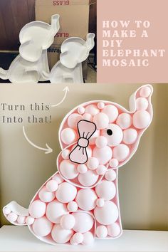 an elephant made out of balloons sitting on top of a table