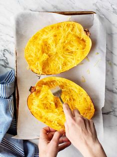 someone is peeling the inside of a squash