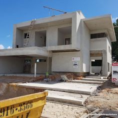 a building under construction with stairs leading up to it