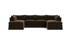 a brown sectional couch sitting on top of a white floor