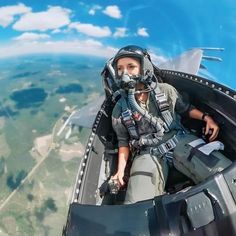 a man is sitting in the cockpit of an airplane