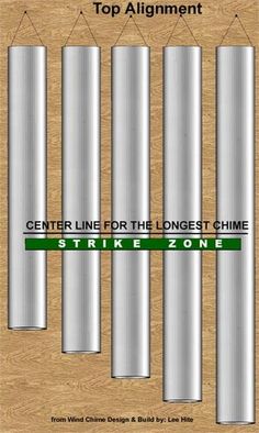 the top alignment of some metal pipes on a wooden surface with text that reads, center line for the largest chime strike zone