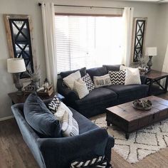 a living room filled with furniture and pillows