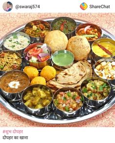 a metal platter filled with lots of different types of food