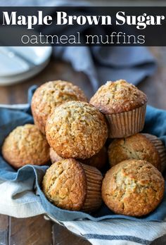 a bunch of muffins sitting on top of a blue cloth in a bowl