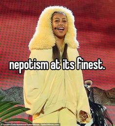 a woman wearing a yellow outfit with a hood on her head and the words nepotism at its finest