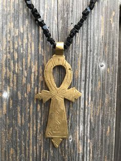 "A very Beautiful Handmade Ethiopian Orthodox Church Cross Pendant. Particularly among Ethiopia Orthodox Church followers to wear a cross implied to be protected by the God as well as to show they're devoted Christian. Dimensions: 4.55\" (115.5 mm) - Height 2.00\" (51 mm)  - width" Handmade Ankh Spiritual Jewelry, Spiritual Ankh Pendant Jewelry, Spiritual Ankh Jewelry With Large Pendant, Handmade Symbolic Crucifix Jewelry, Spiritual Handmade Cross Pendant Jewelry, Unique Ankh-shaped Brass Jewelry, Artisan Ankh Jewelry For Gift, Unique Ankh Shaped Brass Jewelry, Bohemian Ankh Shaped Jewelry For Festivals