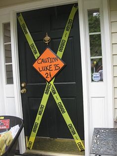 a caution sign on the front door of a house