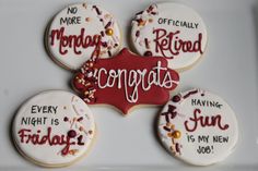 decorated cookies with congratulations written on them in red, white and gold colors are displayed