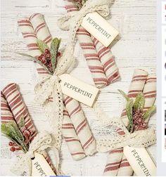 an image of some candy canes wrapped in twine and tied up with ribbons