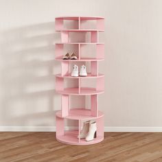 there is a pink shelf with shoes on it