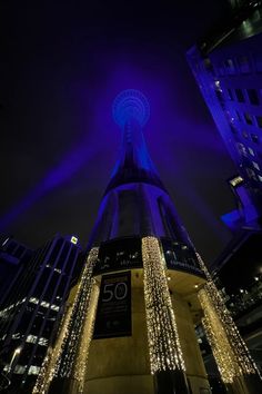 the tower is lit up with christmas lights