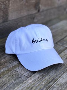 Ready to ship For the bride 🖤 Great for bachelorette parties! Embroidered white dad hat adjustable in the back with a fabric strap One size fits most White Wedding Hats One Size Fits Most, White Wedding Hats, One Size Fits Most, White Wedding Hat, One Size Fits Most, White Wedding Hat (one Size Fits Most), Adjustable Trucker Hat For Wedding, Adjustable White Dad Hat With Curved Bill, White Adjustable Dad Hat With Curved Bill, White Embroidered Trucker Hat With Curved Brim, White Baseball Cap With Embroidered Logo, Adjustable Fit