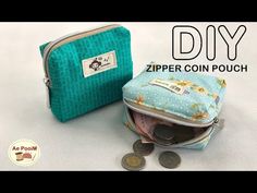 the zipper coin pouch is open and has coins in it next to it, on top of