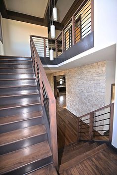 the stairs are made of wood and have metal handrails