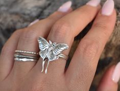 "Luna Moth Ring details: -Solid .925 sterling silver -Luna Moth measures approx. 25x25mm(wing span) -Double Stacked ring band measures 3mm wide -Comfortable and easily stackable! -Available in US sizes 1-11 with half sizes.  *Luna Moth Stacking Ring set shown here: https://www.etsy.com/listing/816431804/luna-moth-ring-moth-ring-sterling-silver?ref=shop_home_active_1&frs=1 Looking for a last minute or unique Christmas gift? Visit our \"READY TO SHIP\" section here, ships out in one business day https://www.etsy.com/shop/AWildViolet?section_id=23587515 Connect with us on Instagram @a_wild_violet for sales and giveaways! **All items are in stock and ship within 2-5 business days from received payment (excluding Saturday/Sunday) from the US. If you are within the US please expect 3-7 business Double Stacked Ring, Moth Ring, Moth Jewelry, Midi Rings Gold, Moon Goddess Necklace, Sunburst Ring, Boho Beads, Art Glass Jewelry, Jewelry Butterfly