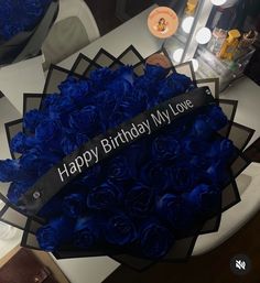 a birthday cake with blue roses on it and the words happy birthday my love written on top