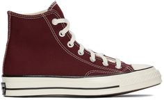 High-top canvas sneakers in burgundy. Round rubber cap toe in off-white. Lace-up closure in white. Eyelet vents and leather logo patch at inner side. Tonal webbing trim at heel. Rubber midsole in off-white featuring black stripes and logo patch at heel. Rubber outsole in brown. Silver-tone hardware. Supplier color: Deep bordeaux/Egret | Converse Burgundy Chuck 70 High Sneakers Burgundy High-top Sneakers For Streetwear, Casual Burgundy High-top Sneakers, Casual Burgundy Sneakers With Contrast Sole, Red Shoes Sneakers, Burgundy Converse, Converse Chuck Taylor 70, Chuck Taylor 70, Converse Chuck 70, High Sneakers