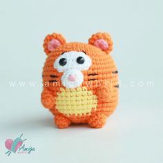 a small crocheted orange and yellow animal