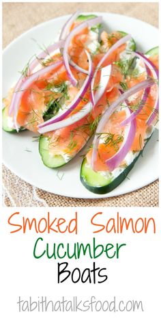 smoked salmon and cucumber boats on a plate with text overlay that reads smoked salmon and cucumber boats