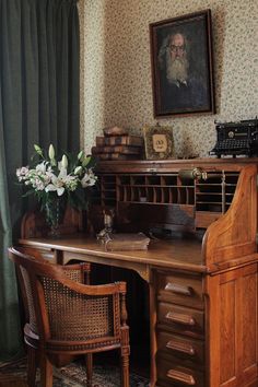 an old fashioned desk and chair in a room