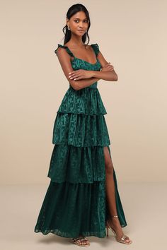 Make a special event even more memorable with the Lulus Stunning Glory Hunter Green Floral Jacquard Tiered Maxi Dress! Lightweight woven chiffon, embellished by a luminous floral jacquard design, shapes adjustable spaghetti straps with ruffled detailing, a subtle sweetheart neckline, and a bustier-inspired bodice with seamed cups. High, fitted waist sits atop a cascading tiered skirt that finishes at a maxi hem with an alluring side slit. Hidden back zipper/clasp. Fit: This garment fits true to size. Length: Floor length. Size medium measures 60" from adjustable straps to hem. Bust: Great for any cup size. Waist: Fitted - very fitted at natural waist. Hip: Not Fitted - fuller skirt allows room for hips. Undergarments: May be worn with a strapless bra, adhesive bra, petals, or no bra. Fabri Jewel Tone Bridesmaid, Design Shapes, Maxi Dress Floral, Adhesive Bra, Green Floral Dress, Bustier Dress, Floral Jacquard, Tiered Maxi Dress