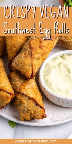 crispy vegan southwest egg rolls on a white plate with ranch dip and lettuce