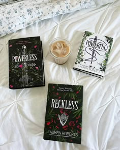 three books sitting on top of a bed next to a bowl of ice cream and a cup of coffee