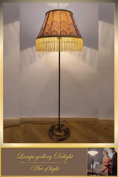 a lamp that is on top of a wooden floor next to a wall with the words lamps gallery delight last of light