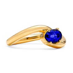 Resting brilliantly at the heart of this contemporary and minimalist design is a brilliant oval shaped sapphire resting in four prongs. The sculptural form presents a striking statement as the swirling high polished silhouette spirals towards the center stone in what we consider a new-aged bypass ring. It has been designed with ease of wearability in mind making it your optimal choice for daily wear. Metal: 18kt Gold Sapphire Weight: 0.92 ct. Measurements: 9.0 mm length *Please note that the lis Modern Bypass Ring With Polished Finish For Formal Occasions, Modern Bypass Ring With Polished Finish, Modern Twist Bypass Ring With Polished Finish, Modern Spiral Ring For Formal Occasions, Modern Spiral Rings For Formal Occasions, Modern Sapphire Birthstone Ring, Modern Yellow Gold Sapphire Ring With Polished Finish, Modern Oval Sapphire Ring With Tension Setting, Modern Oval Sapphire Ring With Polished Finish