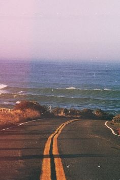 an instagram photo taken on the road to the beach with waves in the background