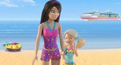 two barbie dolls standing on the beach with a cruise ship in the background