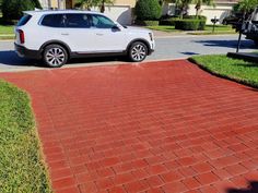 Crimson red stained concrete paver driveway with a satin finish Concrete Driveway Sealer, Outdoor Concrete Floors, Tinted Concrete, Concrete Stains, Driveway Walkway