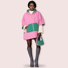 Alpha Kappa Alpha Sorority Paraphernalia Women's Puffer Cape. Women's Pink Puffer Quilted Hoodie Cape Featuring Green Front Pockets, Zipper Closure, and Green Lined Interior. Cape Has 2 Snaps Down Each Side to Create Sleeves. 100% Polyester. Machine Wash Cold. Tumble Dry Low. Pink Zipper Hoodie For Spring, Pink Hooded Outerwear With Patchwork, Pink Hooded Winter Jacket With Zipper, Aka Hoodie, Pink Oversized Hooded Outerwear, Oversized Pink Hooded Outerwear, Aka Paraphernalia Coats & Jackets, Aka Sorority Gifts Coats & Jackets, Alpha Kappa Alpha Sorority Coats & Jackets